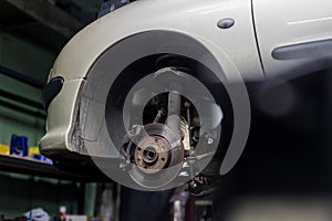 Car brake disk and caliper close up without wheel