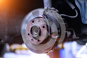 Car brake disk and caliper close up without wheel