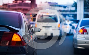 Car brake light on bangkok traffic jam hour with blurred ambulance car in emergency emergency operating and copy space