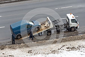 Car break down and towing at snow street. Winter street covered snow roadside, icy