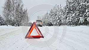 Car breakdown on a country road in winter