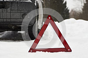 Car with a breakdown on snowy road. Winter driving