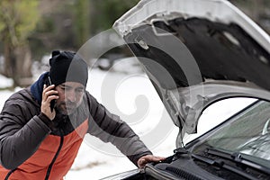 Car breakdown on a snowy winter day