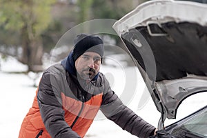 Car breakdown on a snowy winter day