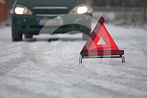 Car breakdown with warning triangle