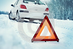 Car breakdown with warning triangle