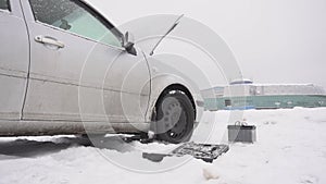 Car breakdown in winter, low-quality diesel fuel freezing and weak battery, problem start, slow motion, instrument