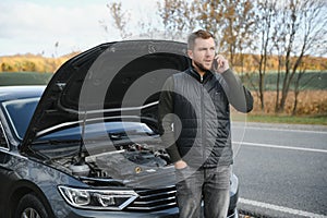 car broke down on the road, a man calls the emergency service, a tow truck.