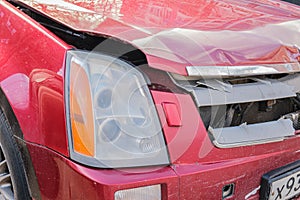 Car with a broken hood and radiator grille