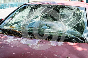 The car with the broken windshield