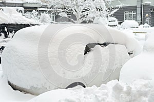 Car buried under the snow. Car buried under the snow and frozen. Bank of snow in winter.