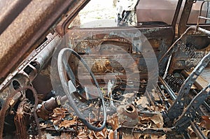 Car burned, abandoned and rusty