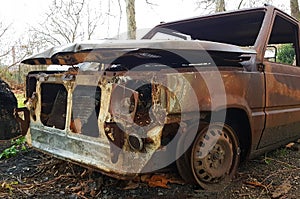 Car burned, abandoned and rusty