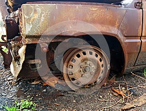 Car burned, abandoned and rusty