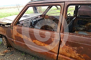 Car burned, abandoned and rusty