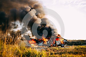 Car Burning With Open flame and black smoke