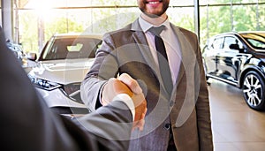 Car Buyer Shaking Hands with Salesman at Auto Dealership - Generative Ai