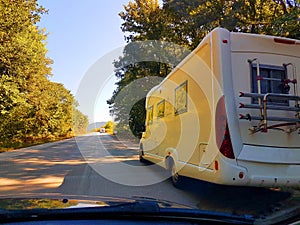 Car caravan on the road in spring moving