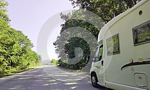 Car caravan on the road in spring moving