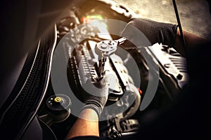 Car care maintenance and servicing, Close-up hand technician auto mechanic using the wrench to repairing change spare part car
