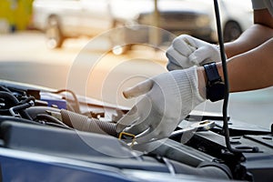 Car care maintenance and servicing, Close-up hand technician auto mechanic using the wrench to repairing change spare part car