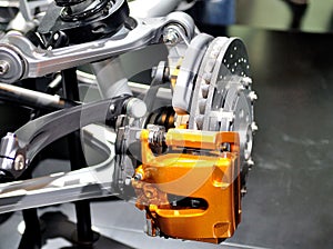 Car ceramic disc brake with yellow caliper.