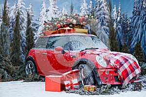 Car with a Christmas tree, wreath and gifts in a snowy forest on a winter day. Christmas decor. Holiday concept.