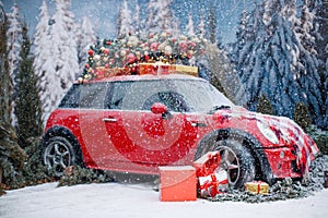 Car with a Christmas tree, wreath and gifts in a snowy forest on a winter day. Christmas decor. Holiday concept.