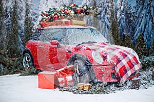 Car with a Christmas tree, wreath and gifts in a snowy forest on a winter day. Christmas decor. Holiday concept.