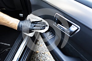 Car cleaning. Cleaning the leather elements in the car door