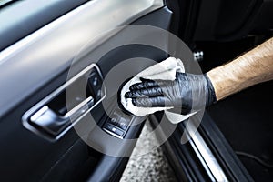 Car cleaning. Cleaning the leather elements in the car door