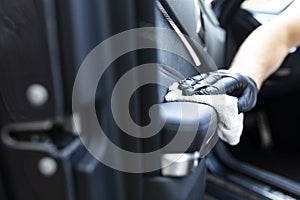 Car cleaning. Cleaning the leather elements in the car door