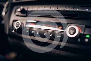 Car clima controls, radio dashboard and cockpit close up photo