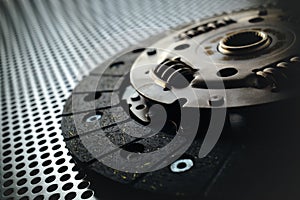 Car clutch on a metal surface