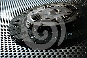 Car clutch on a metal surface