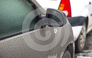 car coated ice crust during the icy rain in cold weather.