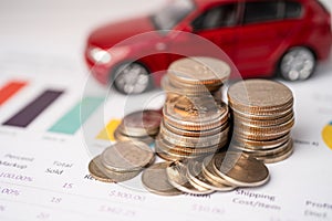 Car with coins on graph background, Car loan, Finance, saving money, insurance and leasing time.