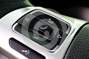 Car control keys for radio volume on leather steering wheel of m