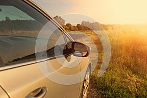 Car on the country road surrounded by nature.