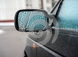 Car covered with ice after freezing rain