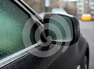 Car covered with ice after freezing rain