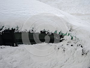 Car covered in snow.