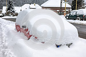 Car covered by snow. Hard winter in city