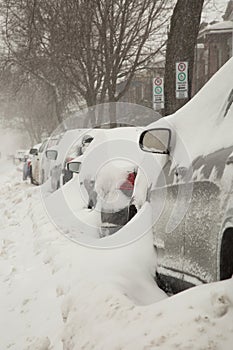 Car covered of snow in a street in Canada