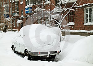 Car covered by a snowdrift