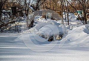 Car covered in snowdrift photo