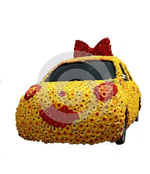 Car cowered with flowers isolated on white