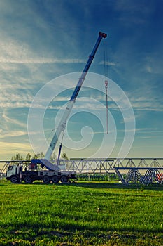 Car crane at the sunset time
