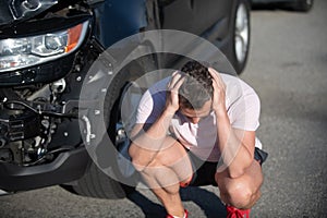 car crash accident. frustrated driver after traffic accident. man with auto broken on road.