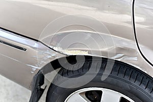 Car crash accident, Paint scratches on rear wheel.